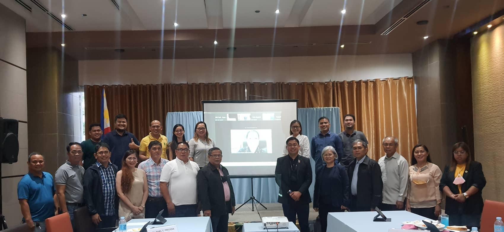 CHED Commissioner Jo Mark M. Libre (1st row, 8th from L-R) leads the photo opportunity with the Board of Regents, key administrative officials and staff of the newly converted SNSU